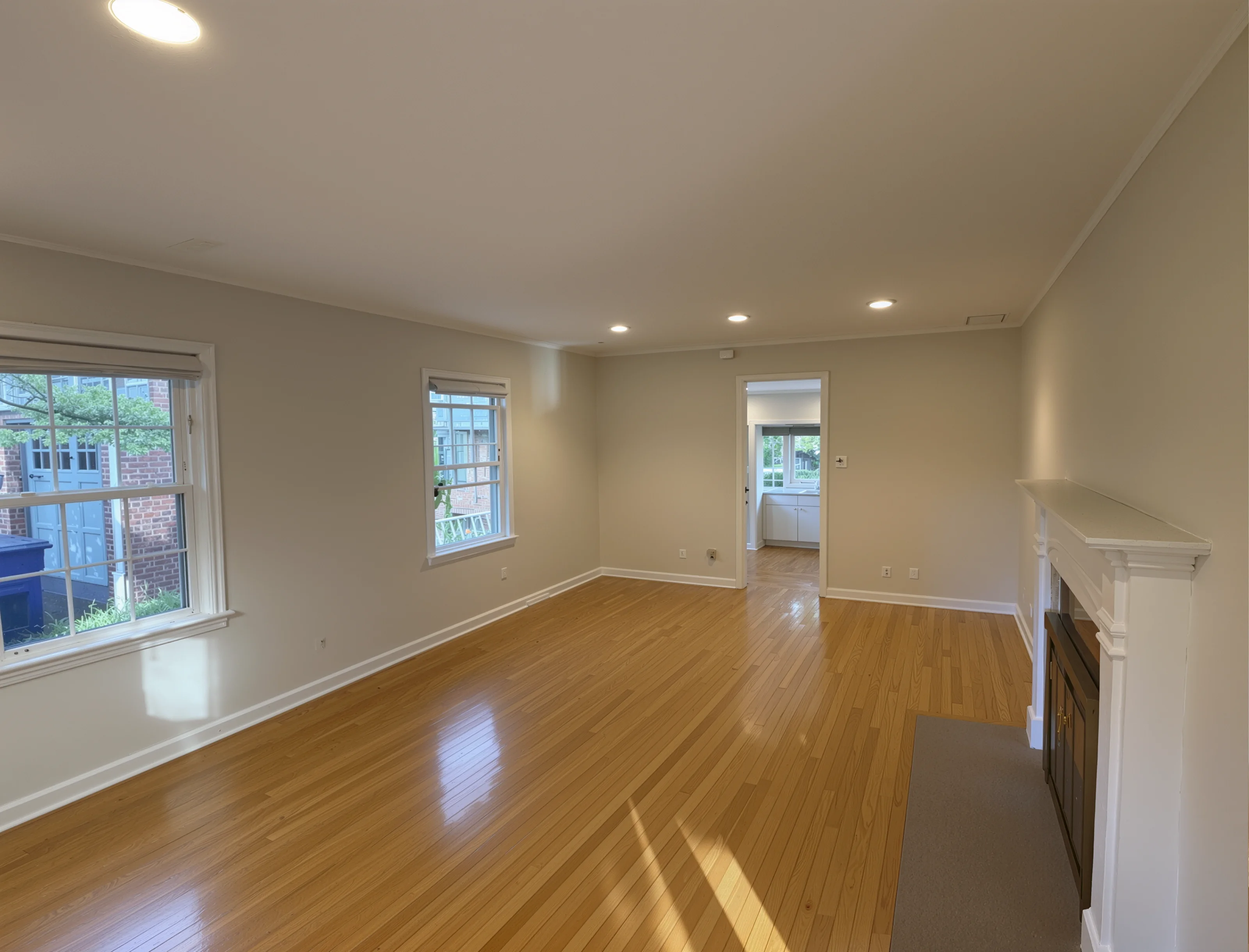 Renovated living room with refinished hardwood floors